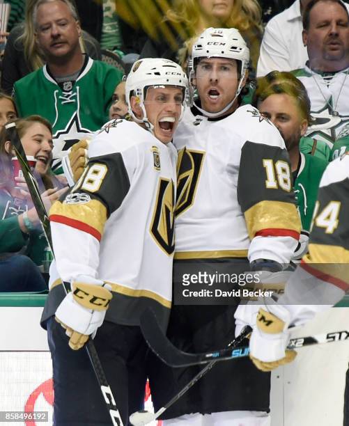 Nate Schmidt and James Neal of the Vegas Golden Knights react after Neal scored a goal against the Dallas Stars during the season opening game at...