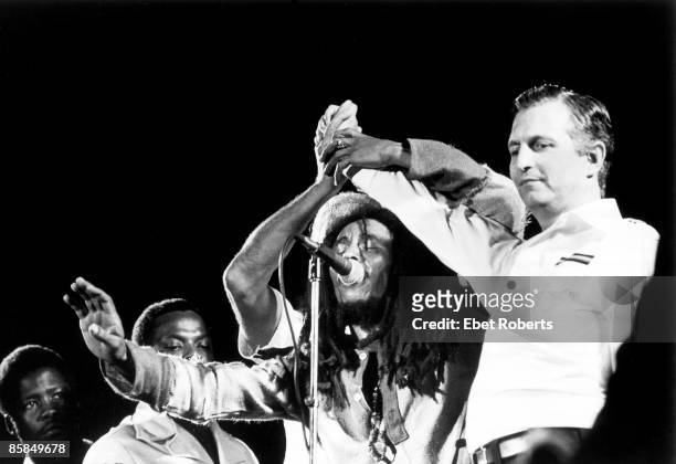 Bob MARLEY; Bob Marley on stage with Prime Minister Michael Manley & opposition leader Edward Seaga at the One love peace concert