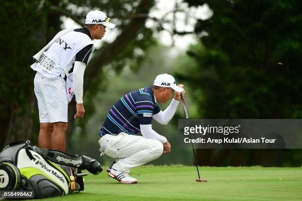 Lu Wei-chih of Taiwan during round three of the Yeangder Tournament Players Championship at Linkou lnternational Golf and Country Club on October 7,...