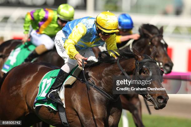 Luke Currie rides Bring Me Roses to win the TAB Edward Manifold Stakes during Turnbull Stakes Day at Flemington Racecourse on October 7, 2017 in...