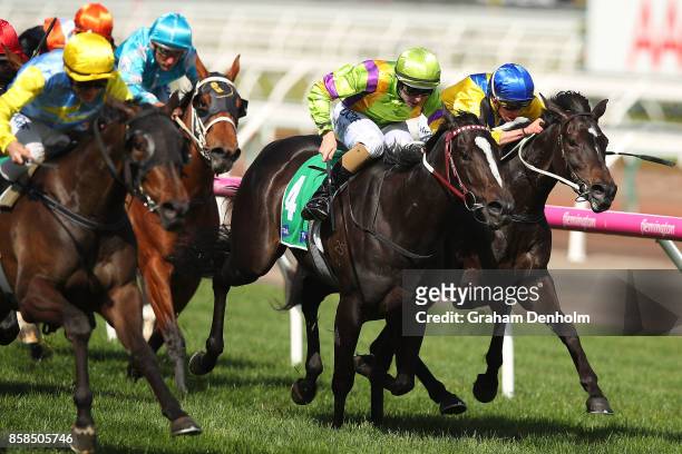 Luke Currie rides Bring Me Roses to win the TAB Edward Manifold Stakes during Turnbull Stakes Day at Flemington Racecourse on October 7, 2017 in...