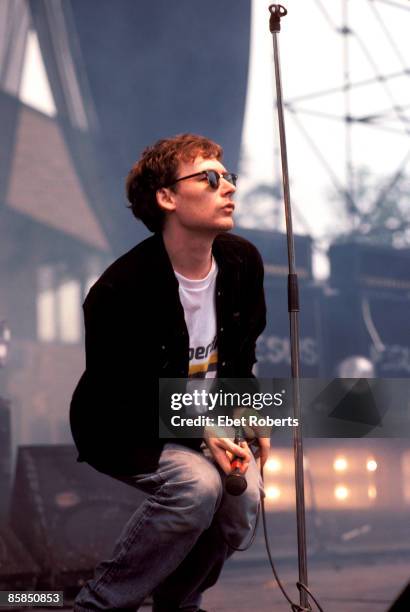 Photo of Jim REID and JESUS & MARY CHAIN, Jim Reid performing on stage at Montage Mountain, Pennsylvania
