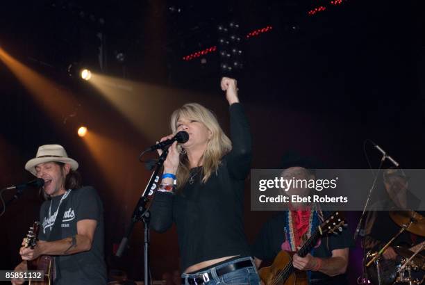 Photo of Willie NELSON; Performing live on stage with daughter Paula Nelson at the Sustainable Biodiesel Alliance Launch Party at the Hard Rock Cafe