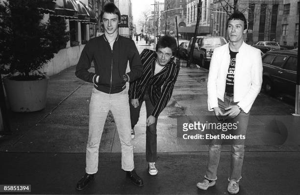 Paul Weller, Bruce Foxton, Rick Buckler of The Jam, posed, group shot on New York street, April 1979.