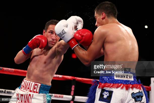 Gamaliel Diaz punches Christian Gonzalez in the third round of their Super Lightweight at Belasco Theatre on October 6, 2017 in Los Angeles,...