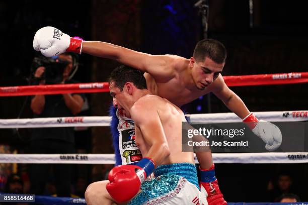 Gamaliel Diaz falls on Christian Gonzalez in the third round of their Super Lightweight at Belasco Theatre on October 6, 2017 in Los Angeles,...