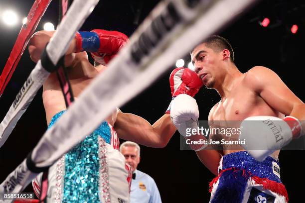 Gamaliel Diaz punches Christian Gonzalez in the second round of their Super Lightweight at Belasco Theatre on October 6, 2017 in Los Angeles,...