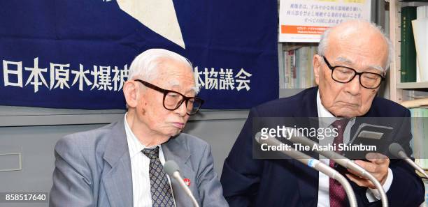 Japan Confederation of A- and H-Bomb Sufferers Organizations Co-Chairperson Terumi Tanaka and advisor Mikiso Iwasa speak during a press conference...
