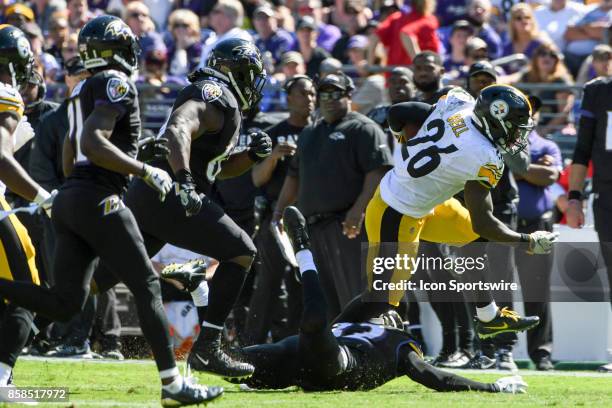 Pittsburgh Steelers running back Le'Veon Bell runs past Baltimore Ravens cornerback Jimmy Smith on October 1 at M&T Bank Stadium in Baltimore, MD....