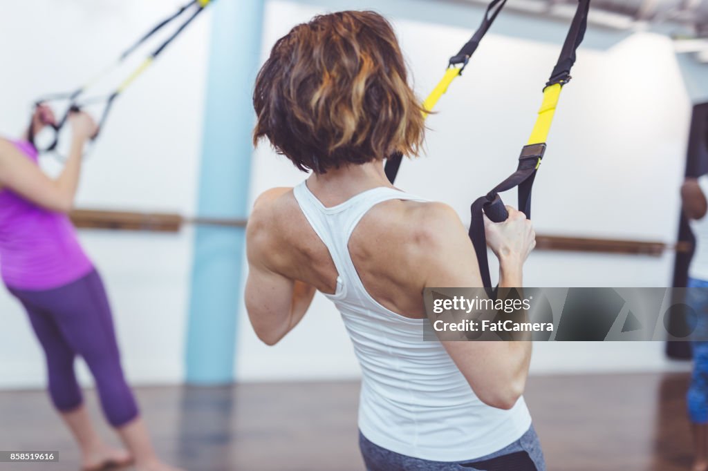 Group of Women Doing TRX Workout