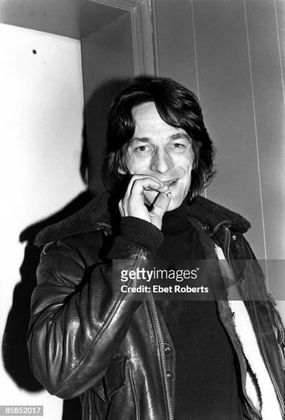Photo of Gene CLARK; Portrait smoking a cigarette