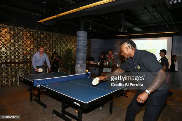 National Football League Commissioner Roger Goodell and New York Giants Wide Receiver Brandon Marshall play ping-pong when they attend Project 375's...