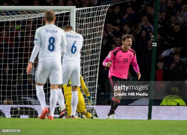 Chris Martin of Scotland celebrates after Martin Skertl of Slovakia puts the ball into his own net to put the Scots 1-0 ahead at Hampden Park on...