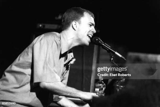 Photo of Ben FOLDS and Ben FOLDS FIVE; Ben Folds performing on stage, profile, playing piano