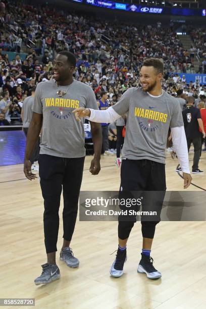 Draymond Green and Stephen Curry of the Golden State Warriors laugh during fan day as part of 2017 NBA Global Games China on October 7, 2017 at the...