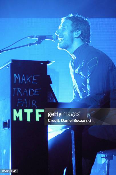 Photo of COLDPLAY and Chris MARTIN; Chris Martin performing on stage, Make Trade Fair on piano
