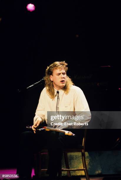 Photo of Jeff HEALEY, Blind guitarist Jeff Healey performing on stage, sitting