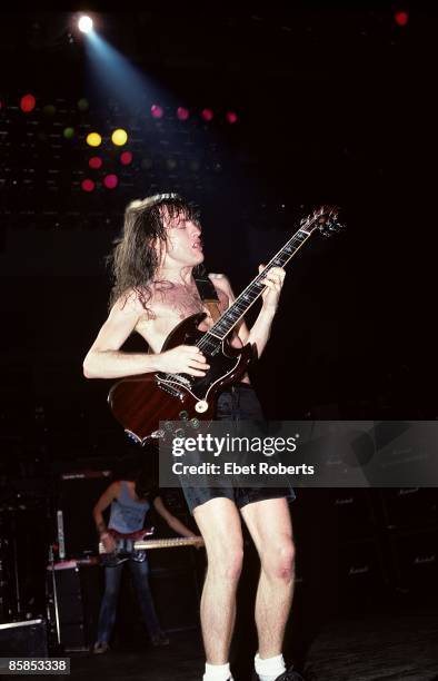 Photo of Angus YOUNG and AC/DC; Angus Young performing on stage