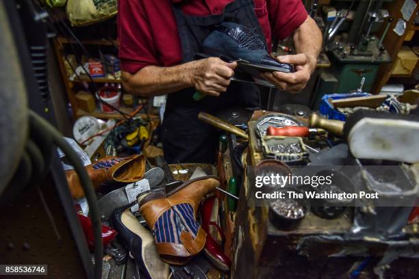 Philip Calabro of Philip's Shoe Repair repairs shoes at his shop on Wednesday, October 4 in Washington, DC. The shop, which sits in the budding...