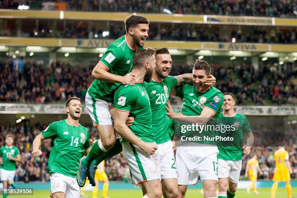 The Irish players celebrate after Daryl Murphy score during the FIFA World Cup 2018 Qualifying Round Group D match between Republic of Ireland and...