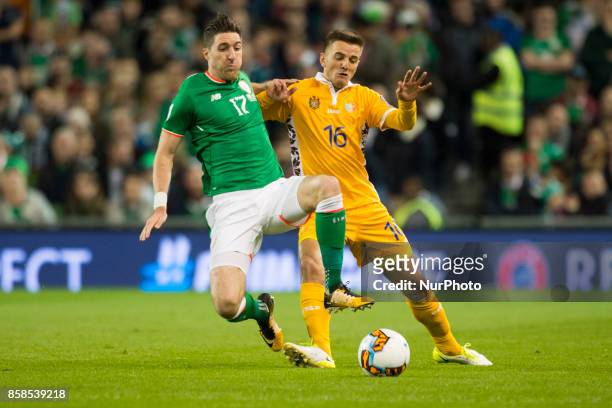 Stephen Ward of Ireland and Sergiu Platica of Moldova fight for the ball during the FIFA World Cup 2018 Qualifying Round Group D match between...