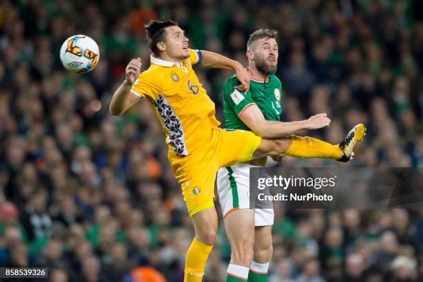 Daryl Murphy of Ireland jumps with Alexandru Gatcan of Moldova during the FIFA World Cup 2018 Qualifying Round Group D match between Republic of...