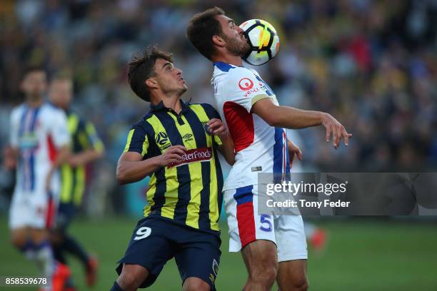 Asdrubal of the Mariners and Benjamin Kantarovski of the jets contest the ball during the round one A-League match between the Central Coast Mariners...