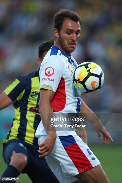 Asdrubal of the Mariners and Benjamin Kantarovski of the jets contest the ball during the round one A-League match between the Central Coast Mariners...