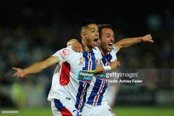 Joseph Champness and Benjamin Kantarovski of the Jets celebrate a goal by Joseph Champness during the round one A-League match between the Central...