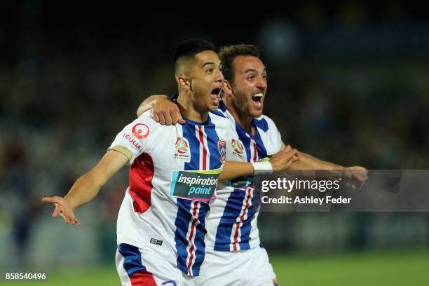 Joseph Champness and Benjamin Kantarovski of the Jets celebrate a goal by Joseph Champness during the round one A-League match between the Central...