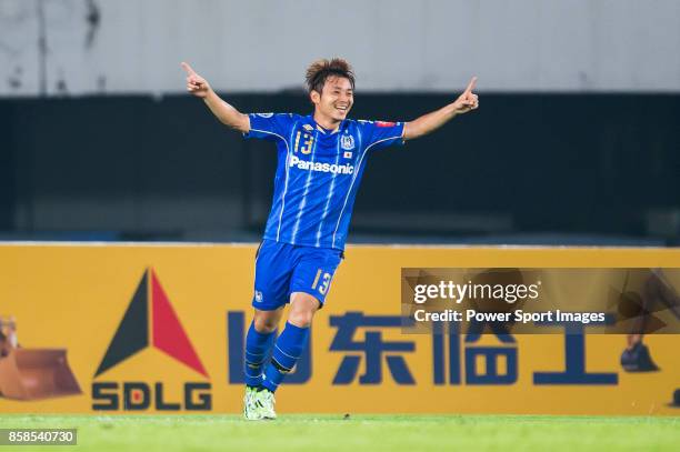 Gamba Osaka midfielder Abe Hiroyuki celebrates during the AFC Champions League 2015 Semi Final 1st Leg match between Guangzhou Evergrande and Gamba...