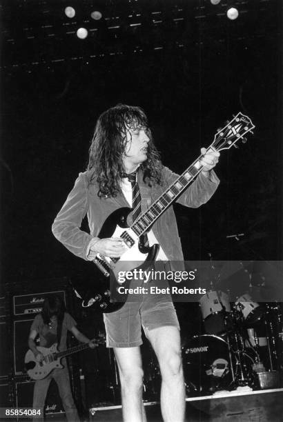 Photo of Angus YOUNG and AC/DC, Angus Young performing on stage