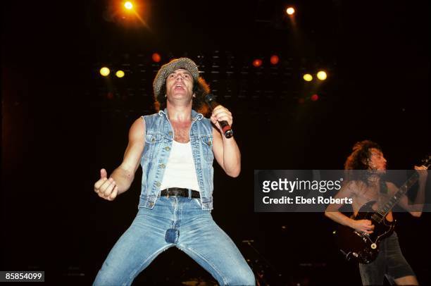 Photo of Angus YOUNG and Brian JOHNSON and AC/DC, Brian Johnson and Angus Young performing on stage