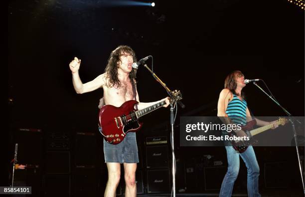 Photo of Cliff WILLIAMS and Angus YOUNG and AC/DC, L-R Angus Young and Cliff Williams performing on stage