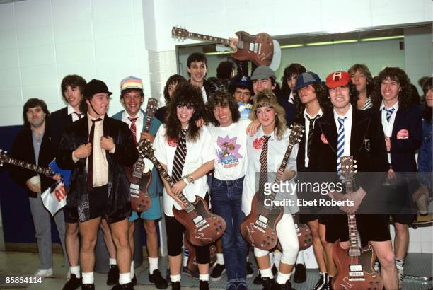Photo of Angus YOUNG and AC/DC, Angus Young backstage with some impersonators
