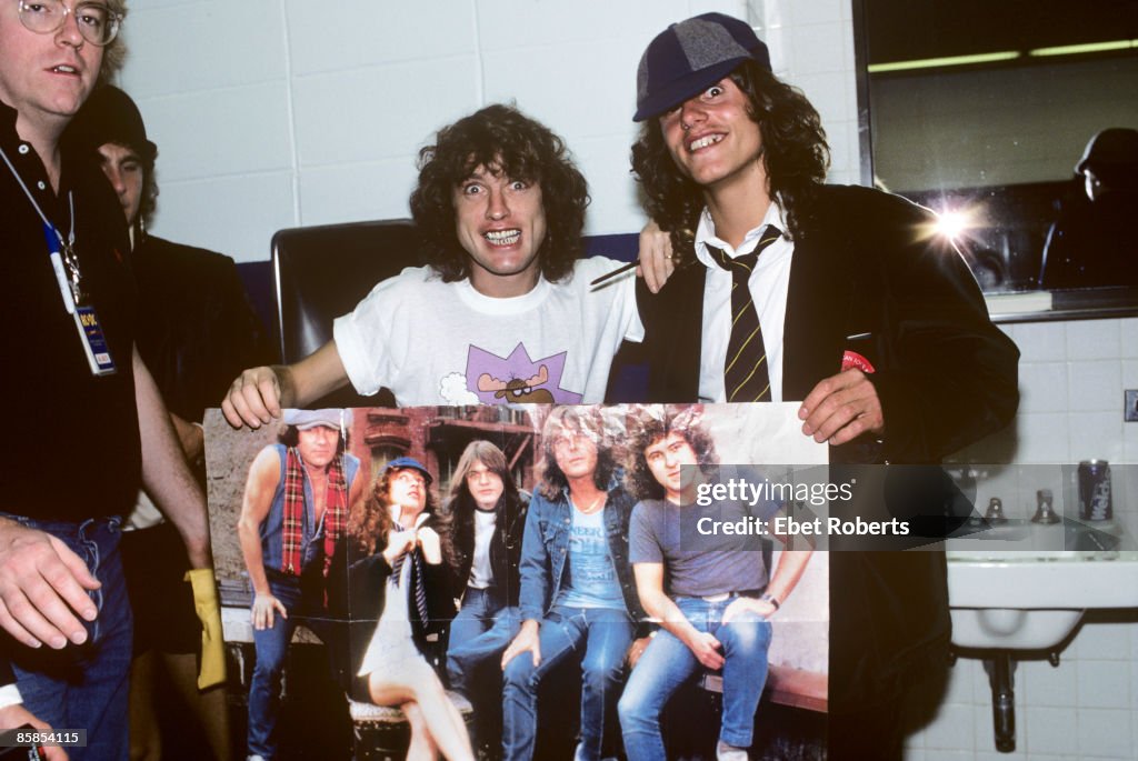 Photo of Angus YOUNG and AC/DC, Angus Young backstage with an... News ...