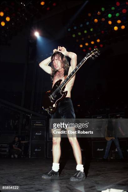 Photo of Angus YOUNG and AC/DC; Angus Young performing on stage