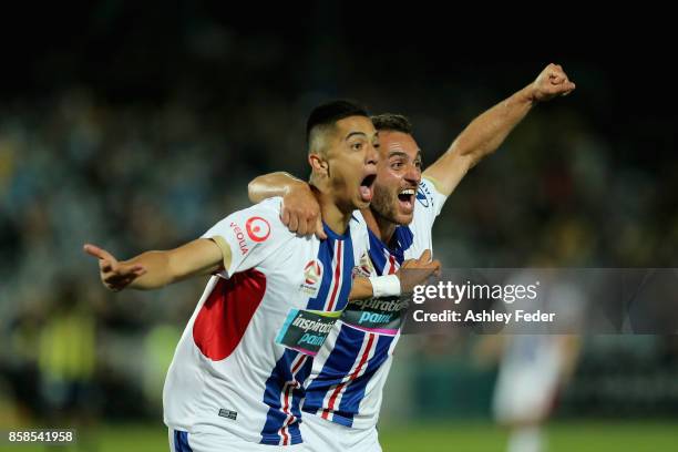 Joseph Champness and Benjamin Kantarovski of the Jets celebrate a goal by Joseph Champness during the round one A-League match between the Central...