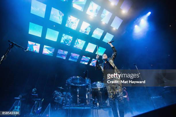 Singer Dan Reynolds of Imagine Dragons performs on stage at KeyArena on October 6, 2017 in Seattle, Washington.