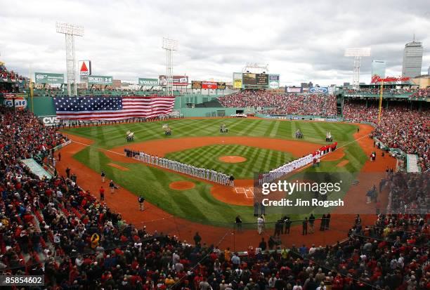 The Boston Red Sox and the Tampa Bay Rays line the field before their opening day game at Fenway Park April 7, 2009 in Boston, Massachusetts.