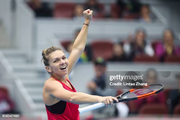 Simona Halep of Romania celebrates after winning the Women's Singles Semifinals match against Jelena Ostapenko of Latvia on day eight of 2017 China...