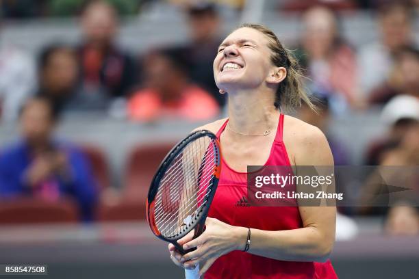 Simona Halep of Romania celebrates after winning the Women's Singles Semifinals match against Jelena Ostapenko of Latvia on day eight of 2017 China...