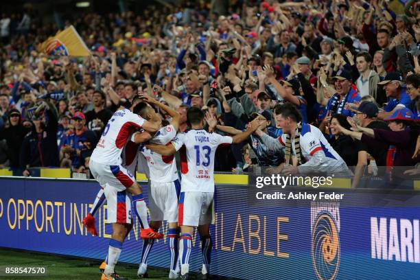 Jets fans celebrate a goal from Joseph Champness of the Jets during the round one A-League match between the Central Coast Mariners and the Newcastle...