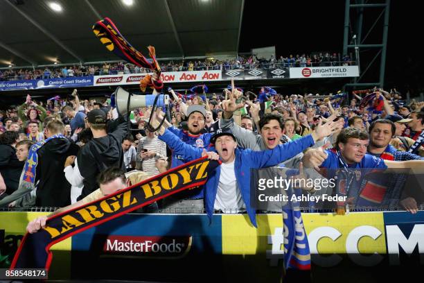 Jets fans celebrate the win during the round one A-League match between the Central Coast Mariners and the Newcastle Jets at Central Coast Stadium on...