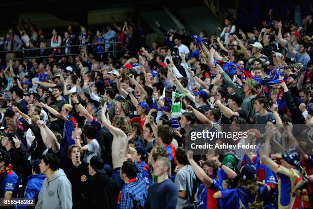 Jets fans celebrate during the round one A-League match between the Central Coast Mariners and the Newcastle Jets at Central Coast Stadium on October...