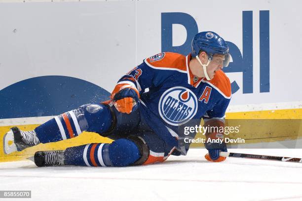 Ales Hemsky of the Edmonton Oilers lays on the ice during the game against the Detroit Red Wings at Rexall Place on March 24, 2009 in Edmonton,...