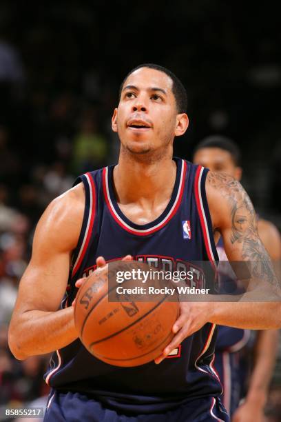 Devin Harris of the New Jersey Nets shoots a free throw during the game against the Golden State Warriors at Oracle Arena on March 11, 2009 in...