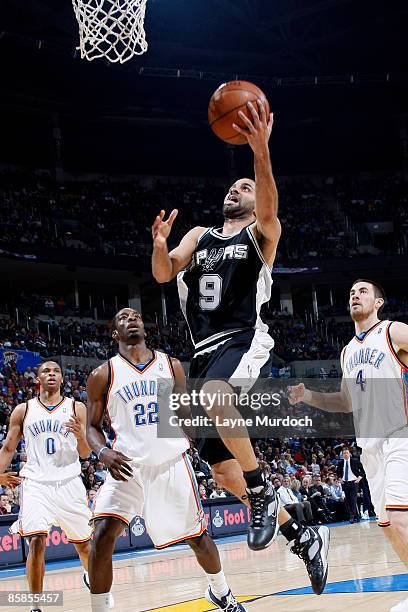 Tony Parker of the San Antonio Spurs lays the ball up against Jeff Green of the Oklahoma City Thunder at the Ford Center April 7, 2009 in Oklahoma...