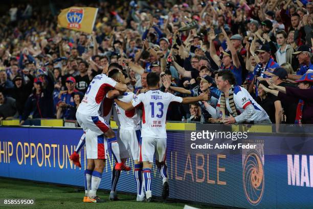 Jets fans celebrate a goal from Joseph Champness of the Jets during the round one A-League match between the Central Coast Mariners and the Newcastle...