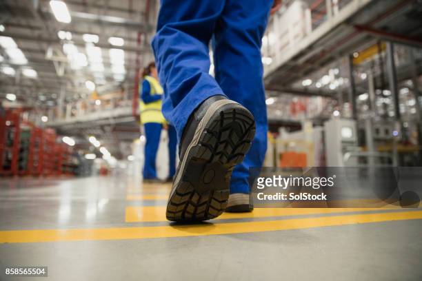 close-up of a workers boot - bota imagens e fotografias de stock